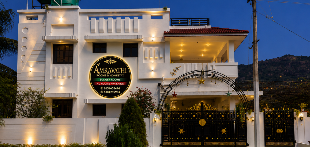 Exterior front view of Amaravathy Rooms and Homestay at dusk